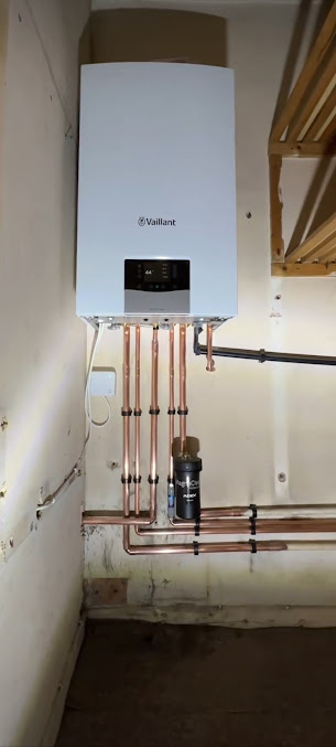 Wall-mounted Vaillant boiler with neat copper pipework